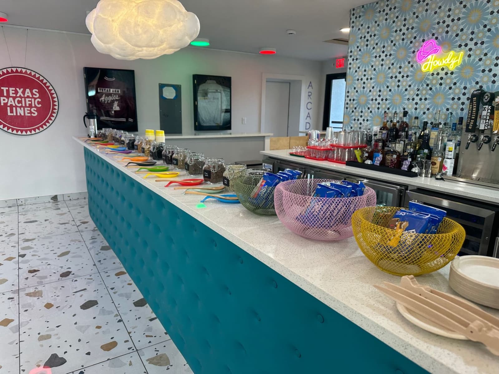 Commercial counter with jars, baskets, and beverage service area