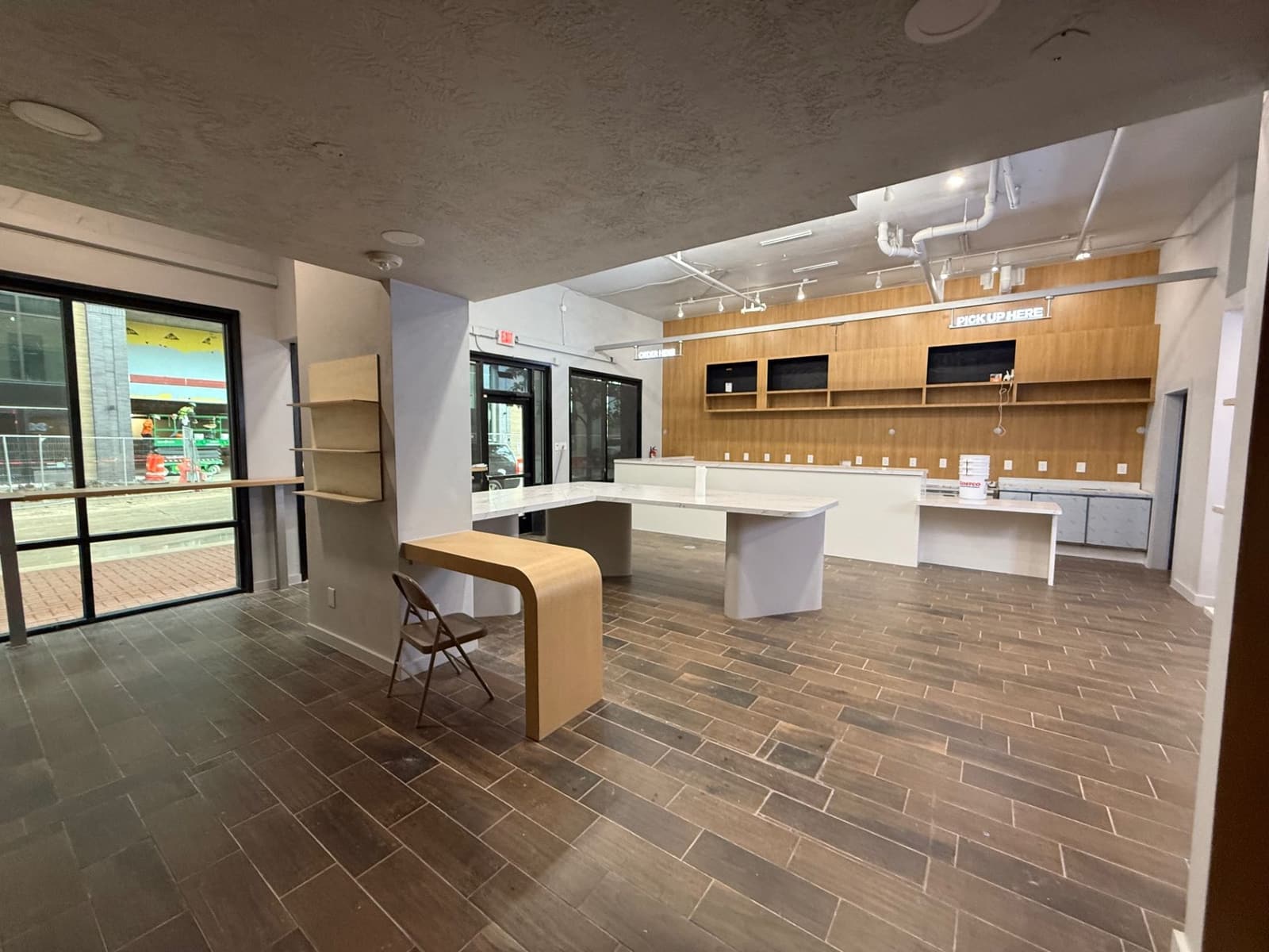 Commercial interior with service counters, wood millwork, and tiled floor